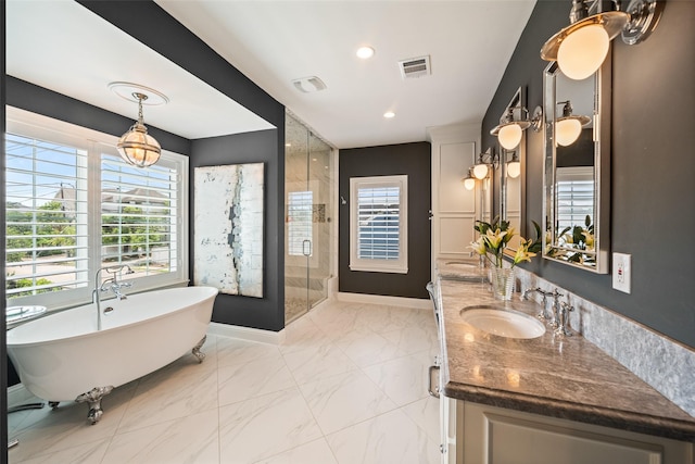 2202 Sul Ross St, Houston, TX 77098 - bathroom with healthy amount of natural light, a shower stall, a freestanding bath, and recessed lighting