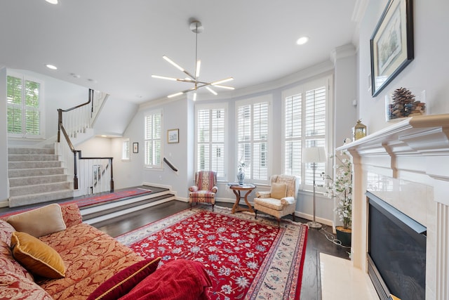 4305 Feagan St, Houston, TX 77007 - living room with wood finished floors, a high end fireplace, baseboards, stairway, and recessed lighting