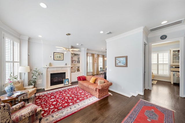 4305 Feagan St, Houston, TX 77007 - living area with wood finished floors, crown molding, ceiling fan, a fireplace, and recessed lighting