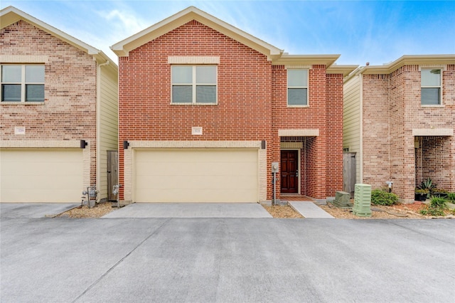 3721 Main Poplar Dr, Houston, TX 77025 - traditional-style house with a garage, driveway, and brick siding