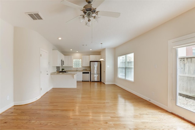 3721 Main Poplar Dr, Houston, TX 77025 - unfurnished living room with plenty of natural light, light wood finished floors, ceiling fan, baseboards, and recessed lighting