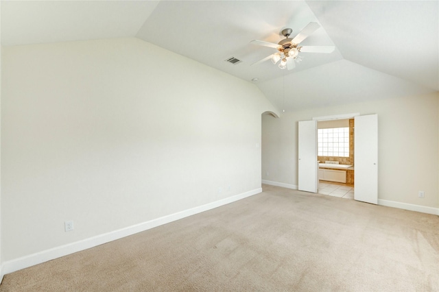 3721 Main Poplar Dr, Houston, TX 77025 - bonus room with vaulted ceiling, arched walkways, light carpet, ceiling fan, and baseboards