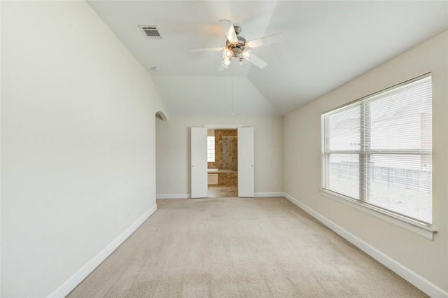 3721 Main Poplar Dr, Houston, TX 77025 - unfurnished room featuring a ceiling fan, baseboards, light colored carpet, and vaulted ceiling