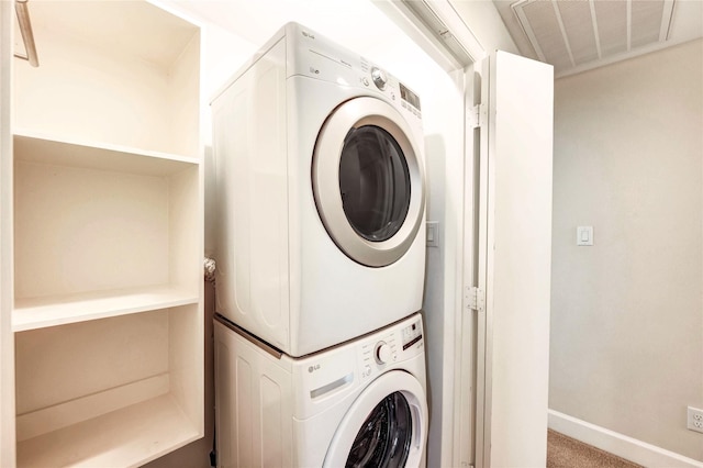 3721 Main Poplar Dr, Houston, TX 77025 - laundry area with stacked washer / dryer, carpet flooring, and baseboards