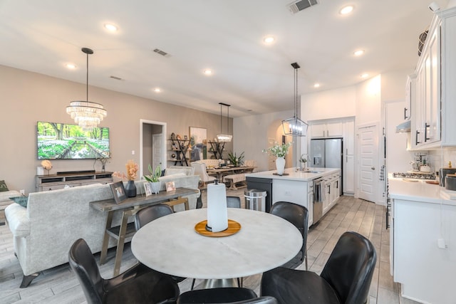 30707 Thicket Ct, Fulshear, TX 77441 - dining room featuring wood finish floors, a chandelier, and recessed lighting