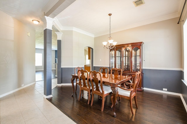 18002 Outback Lakes Trl, Humble, TX 77346 - dining room with arched walkways, ornamental molding, wood finished floors, a chandelier, and baseboards