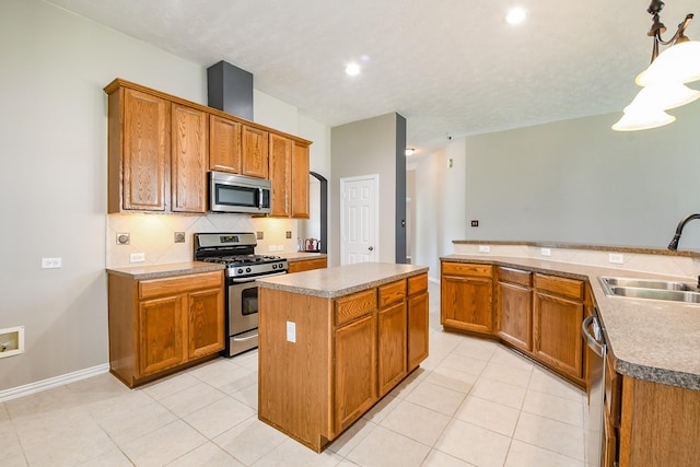 18002 Outback Lakes Trl, Humble, TX 77346 - kitchen with appliances with stainless steel finishes, a sink, a kitchen island, tasteful backsplash, and light tile patterned flooring