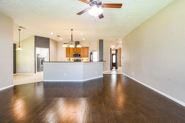 18002 Outback Lakes Trl, Humble, TX 77346 - unfurnished living room featuring washer / dryer, a ceiling fan, hardwood / wood-style flooring, baseboards, and recessed lighting