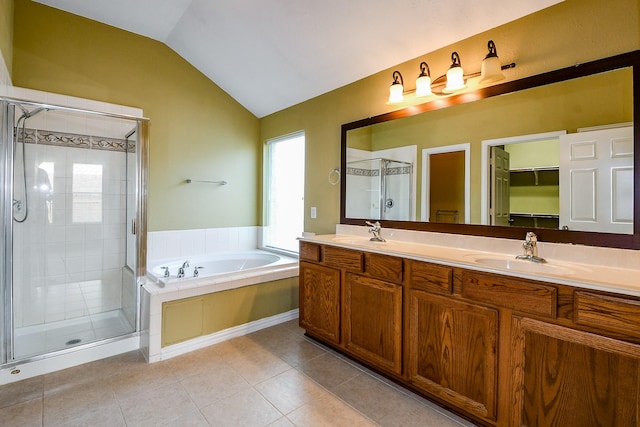18002 Outback Lakes Trl, Humble, TX 77346 - full bath with a stall shower, a bath, double vanity, vaulted ceiling, and tile patterned flooring