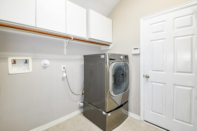 18002 Outback Lakes Trl, Humble, TX 77346 - laundry room featuring washer / dryer, cabinet space, baseboards, and light tile patterned floors