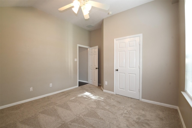 18002 Outback Lakes Trl, Humble, TX 77346 - unfurnished bedroom featuring carpet flooring, baseboards, lofted ceiling, and ceiling fan