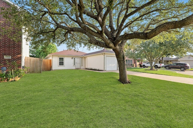 6427 Burdine Ct, Houston, TX 77085 - view of yard featuring an attached garage and concrete driveway