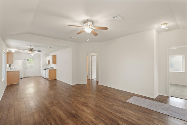 6427 Burdine Ct, Houston, TX 77085 - unfurnished living room featuring ceiling fan, lofted ceiling, dark wood-type flooring, and a sink