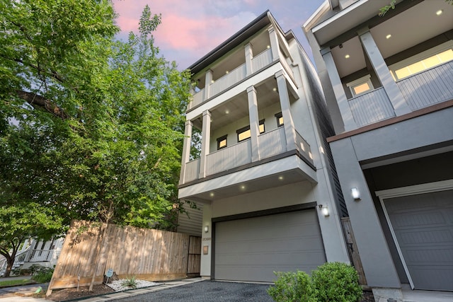 208 Aurora St Unit B, Houston, TX 77008 - view of front of property with a garage, stucco siding, and driveway
