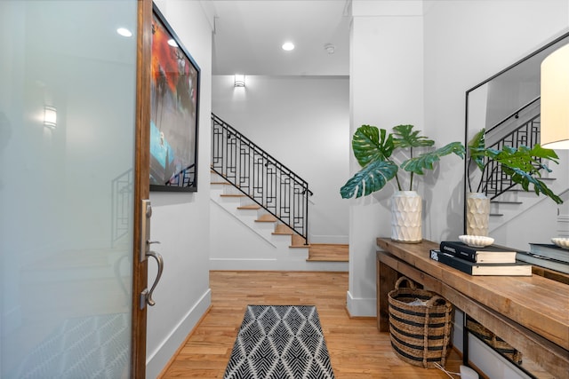 208 Aurora St Unit B, Houston, TX 77008 - foyer entrance with stairs, wood finished floors, baseboards, and recessed lighting