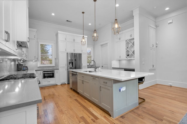 208 Aurora St Unit B, Houston, TX 77008 - kitchen featuring a sink, backsplash, stainless steel dishwasher, light wood-style floors, and recessed lighting