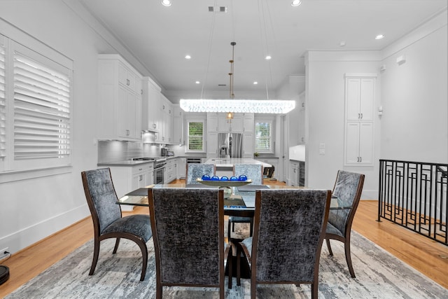 208 Aurora St Unit B, Houston, TX 77008 - dining room with light wood-style floors, ornamental molding, recessed lighting, and baseboards