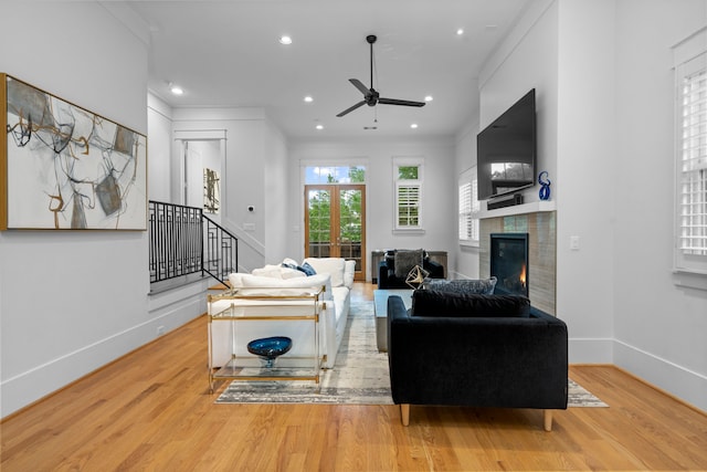 208 Aurora St Unit B, Houston, TX 77008 - living area with a ceiling fan, wood finished floors, a fireplace, stairs, and baseboards
