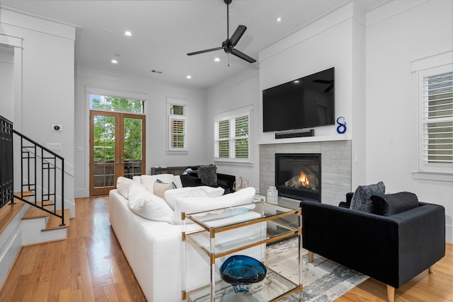208 Aurora St Unit B, Houston, TX 77008 - living room with wood finished floors, a tile fireplace, plenty of natural light, stairway, and ornamental molding