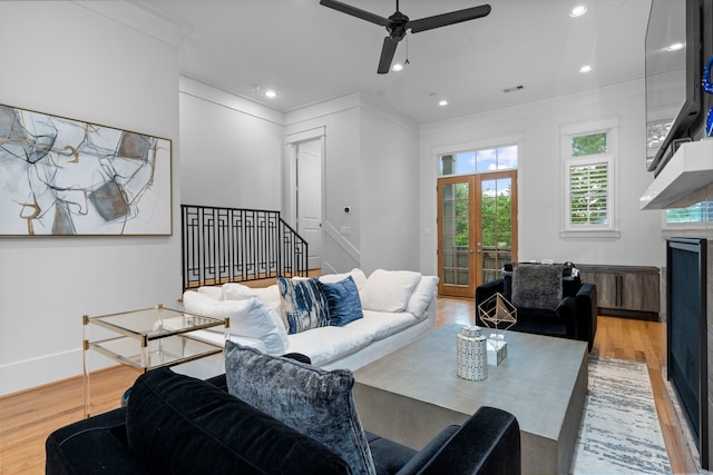 208 Aurora St Unit B, Houston, TX 77008 - living area with light wood-style floors, a ceiling fan, ornamental molding, a fireplace, and recessed lighting