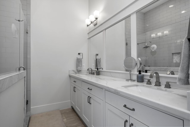 208 Aurora St Unit B, Houston, TX 77008 - bathroom with double vanity, tiled shower, and baseboards