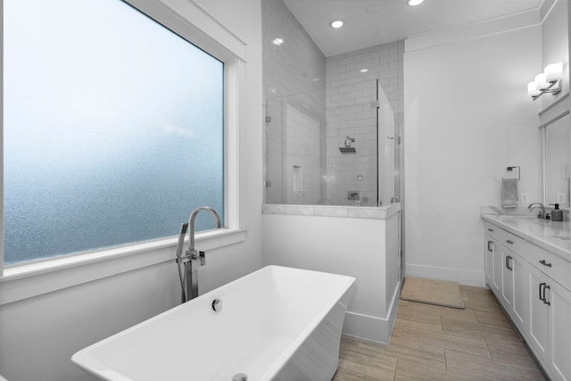 208 Aurora St Unit B, Houston, TX 77008 - full bath featuring a tile shower, recessed lighting, a freestanding bath, and vanity