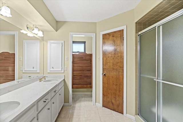 30814 Quinn Rd, Tomball, TX 77375 - bathroom featuring double vanity, baseboards, a shower with door, and tile patterned flooring