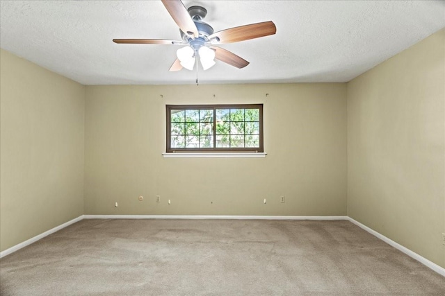 30814 Quinn Rd, Tomball, TX 77375 - carpeted spare room with ceiling fan, baseboards, and a textured ceiling