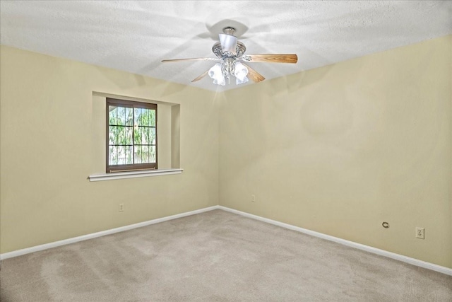 30814 Quinn Rd, Tomball, TX 77375 - carpeted empty room featuring a textured ceiling, baseboards, and ceiling fan