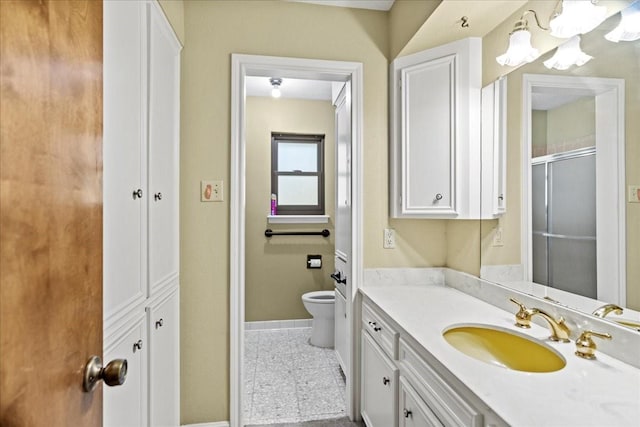30814 Quinn Rd, Tomball, TX 77375 - full bathroom with baseboards, vanity, toilet, a shower with door, and a chandelier