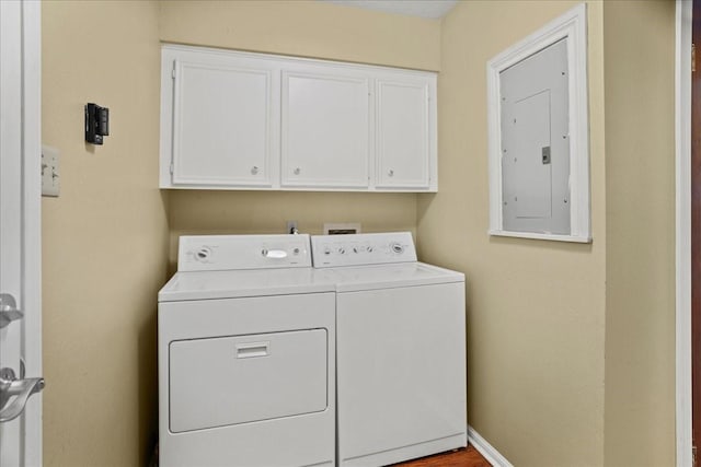 30814 Quinn Rd, Tomball, TX 77375 - laundry area featuring cabinet space, electric panel, and washing machine and dryer