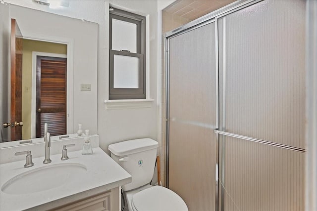 30814 Quinn Rd, Tomball, TX 77375 - bathroom featuring toilet, vanity, and a shower stall