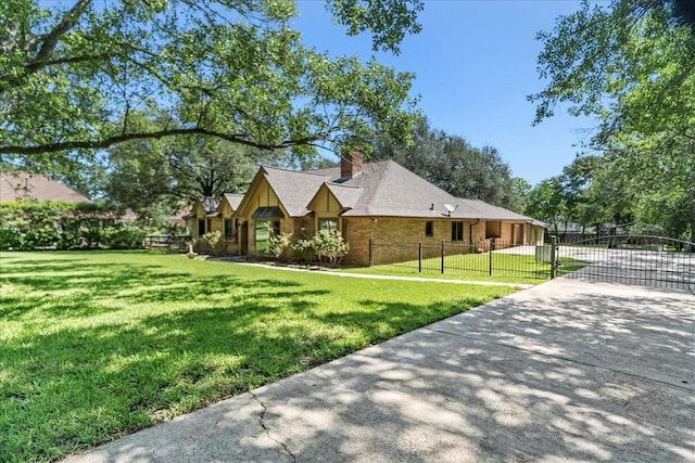 30814 Quinn Rd, Tomball, TX 77375 - view of front of home with a chimney, a gate, concrete driveway, and brick siding