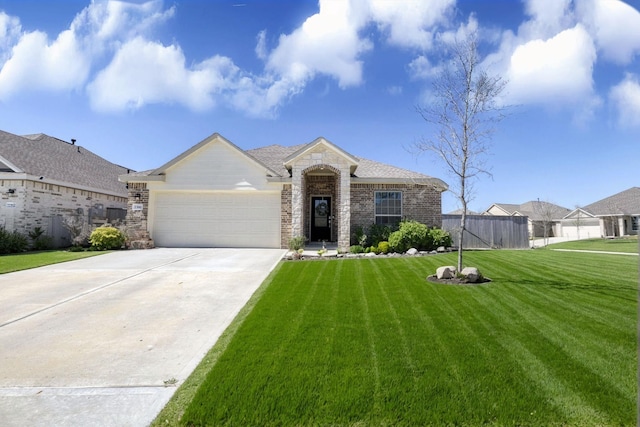1386 Antigua Dr, Conroe, TX 77301 - view of front of house featuring an attached garage, driveway, and brick siding