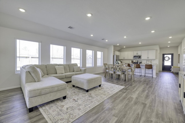 1386 Antigua Dr, Conroe, TX 77301 - living room featuring baseboards, light wood-style floors, and recessed lighting