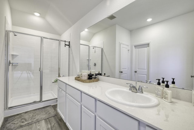 1386 Antigua Dr, Conroe, TX 77301 - full bath featuring a shower stall, vanity, wood finished floors, recessed lighting, and lofted ceiling