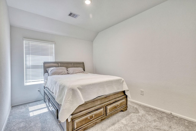 1386 Antigua Dr, Conroe, TX 77301 - bedroom with light carpet, lofted ceiling, and baseboards