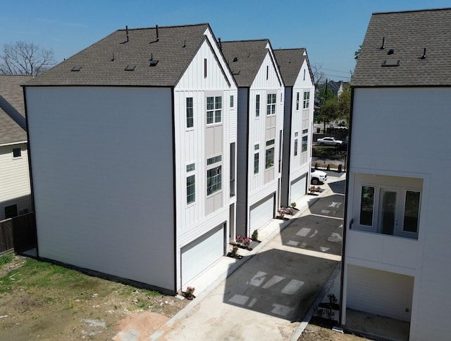 3907C Tulane St, Houston, TX 77018 - exterior space with board and batten siding and a shingled roof