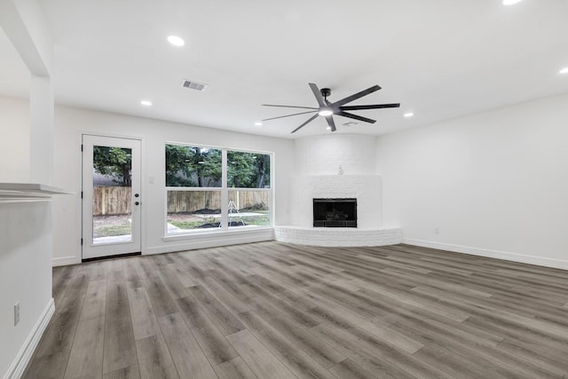 9602 Ballin David Dr, Spring, TX 77379 - unfurnished living room with wood finished floors, a ceiling fan, baseboards, and recessed lighting