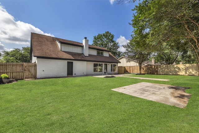 9602 Ballin David Dr, Spring, TX 77379 - rear view of property with a patio area, a chimney, brick siding, and a gate