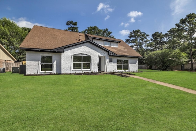 9602 Ballin David Dr, Spring, TX 77379 - view of front of home with central air condition unit, a shingled roof, and brick siding