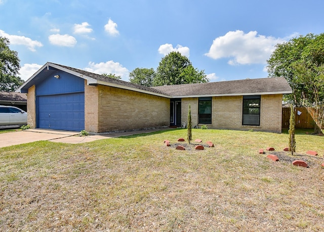 16806 Grampin Dr, Houston, TX 77084 - view of front facade featuring a garage, concrete driveway, and brick siding