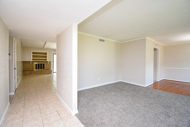 16806 Grampin Dr, Houston, TX 77084 - spare room with baseboards, light carpet, light tile patterned floors, and crown molding