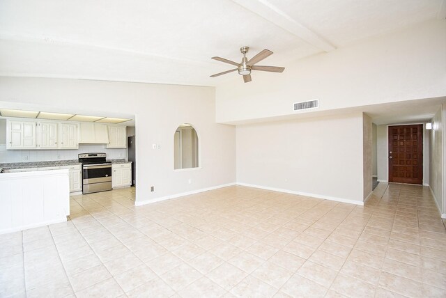 16806 Grampin Dr, Houston, TX 77084 - unfurnished living room with a ceiling fan, light tile patterned flooring, and baseboards