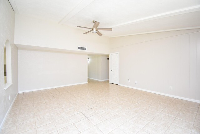 16806 Grampin Dr, Houston, TX 77084 - unfurnished room featuring ceiling fan, light tile patterned flooring, arched walkways, and baseboards