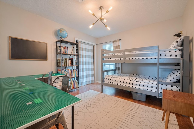 2211 Wycliffe Dr, Houston, TX 77043 - bedroom featuring a chandelier and wood finished floors