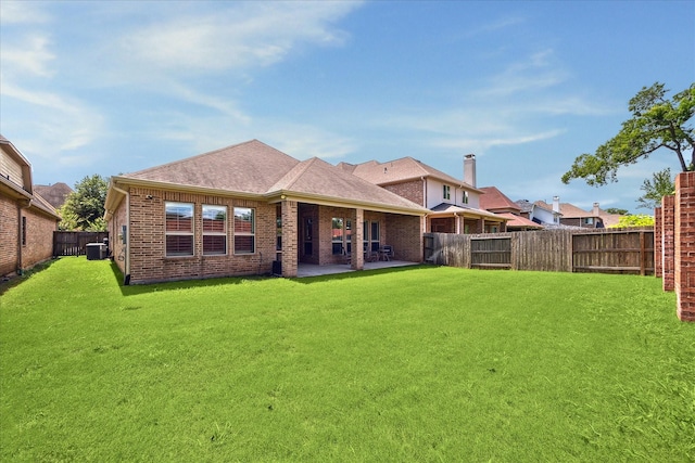 5131 Anthony Springs Ln, Sugar Land, TX 77479 - rear view of property with brick siding, cooling unit, a patio, and roof with shingles