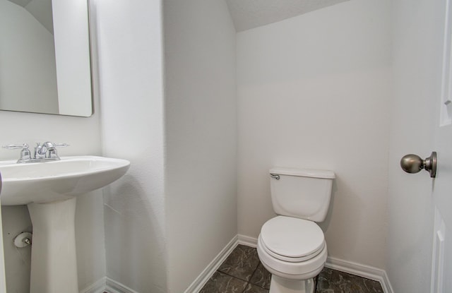 24206 Moon Ridge Ct, Katy, TX 77494 - bathroom featuring toilet, baseboards, and a sink