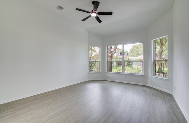 24206 Moon Ridge Ct, Katy, TX 77494 - empty room featuring wood finished floors, baseboards, ceiling fan, and lofted ceiling