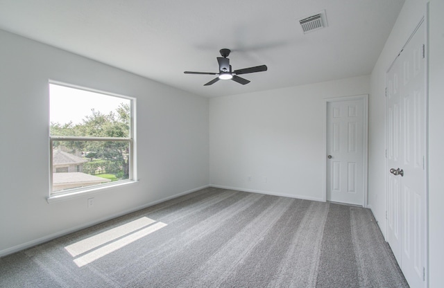 24206 Moon Ridge Ct, Katy, TX 77494 - unfurnished bedroom featuring carpet, a closet, baseboards, and a ceiling fan